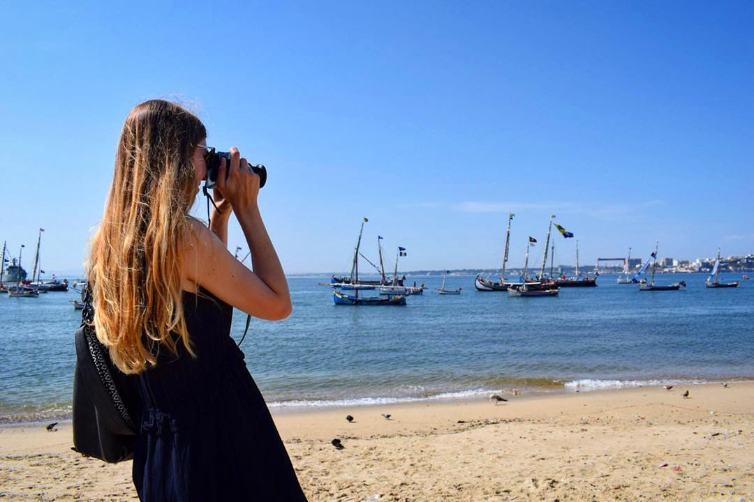 Woman taking photo in Lisbon Portugal