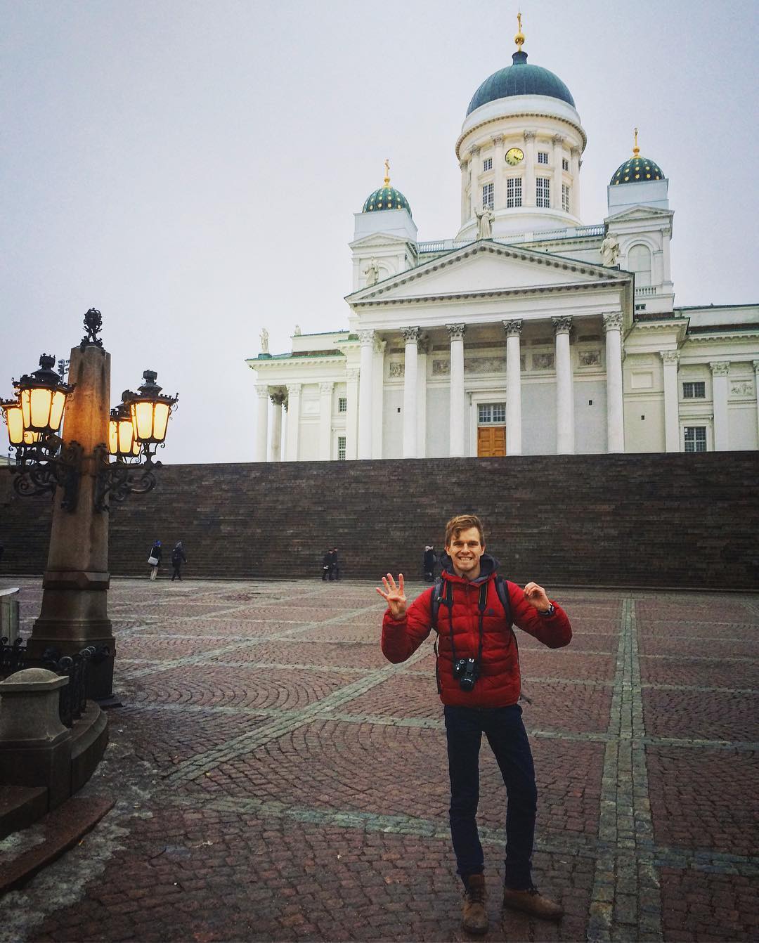 Man with red jacket in Helsinki Finland