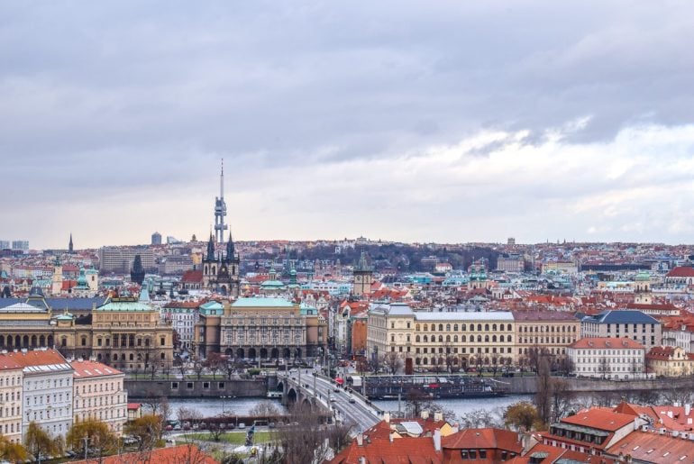 colourful city buildings with river from above things to do in prague