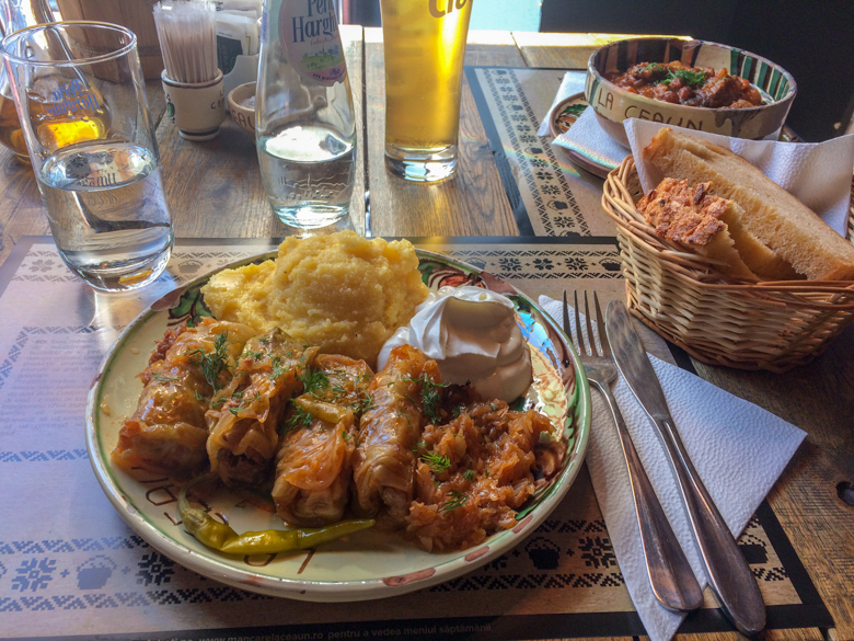 cabbage rolls and goulash and beer on table
