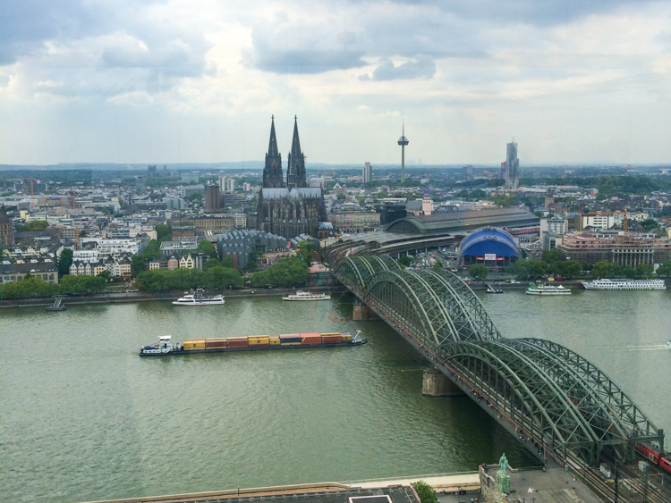 cologne cathedral and river with bridge europe trip itinerary