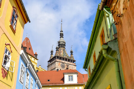 colourful rooftops with clock tower sighisoara romania