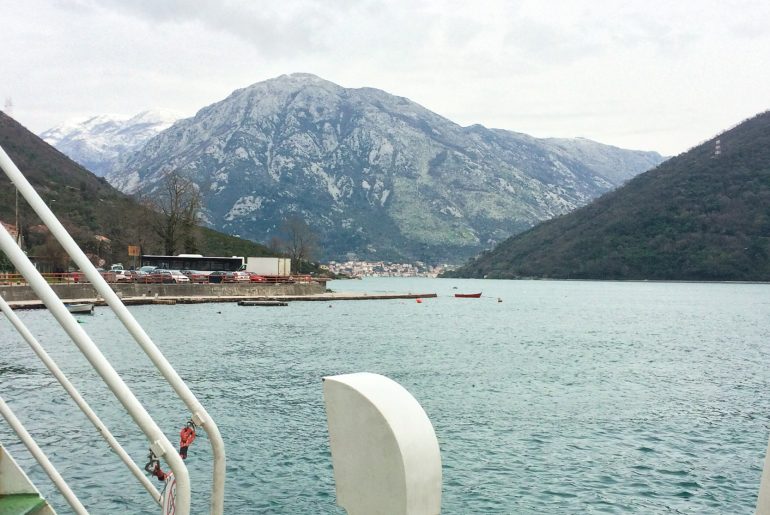 mountain and water view from bus door in montenegro to croatia
