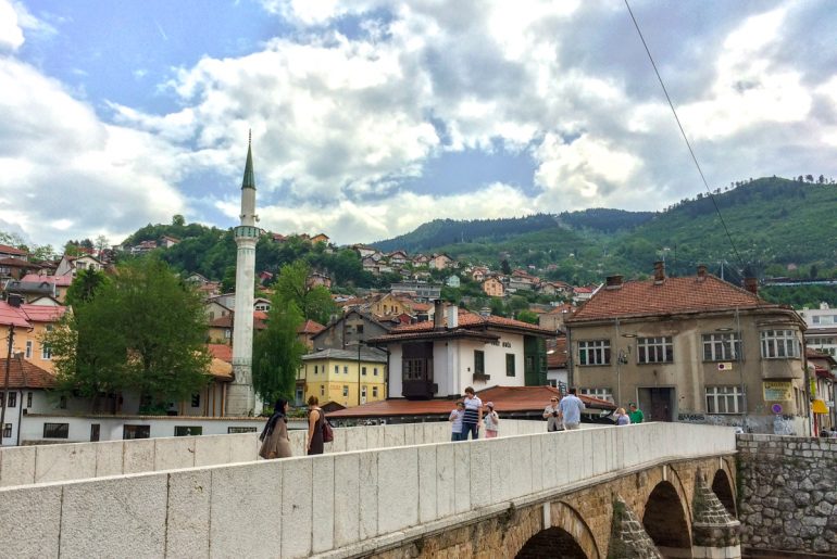 bridge and mosque with blue sky things to do in sarajevo