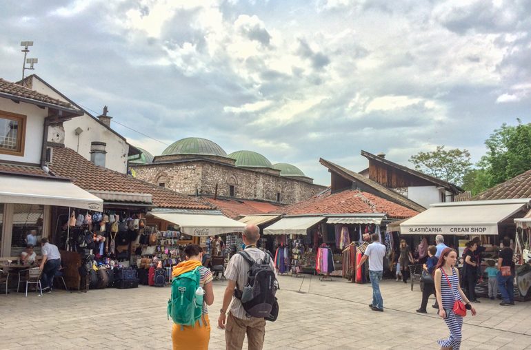 people walking through turkish market things to do in sarajevo