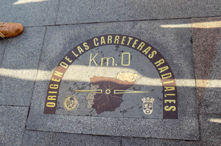 gold and stone marker in the sidewalk things to do in madrid