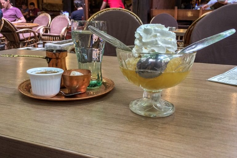 stuffed apple in bowl with spoons and turkish coffee best restaurants in sarajevo