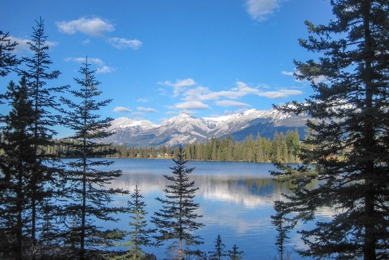 jasper blue lake with mountain and green pine trees canada sightseeing