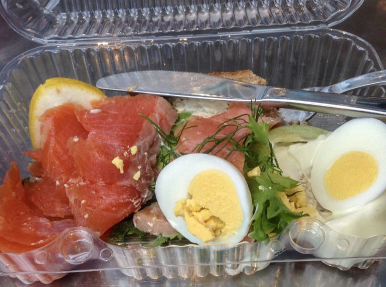salmon and hard boiled eggs in plastic container on tallinn to helsinki ferry crossing