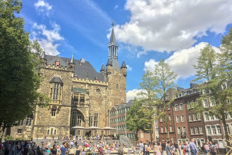 open air square with old buildings and blue sky things to do in aachen