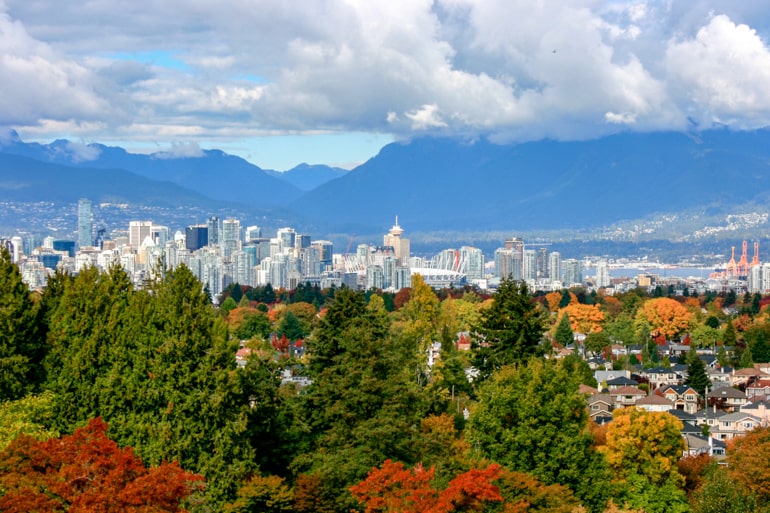 autumn leaves with downtown vancouver buildings best time of year to visit canada