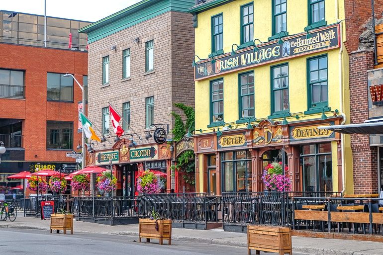 two traditional irish pub shop fronts with sidewalk in front ottawa pubs