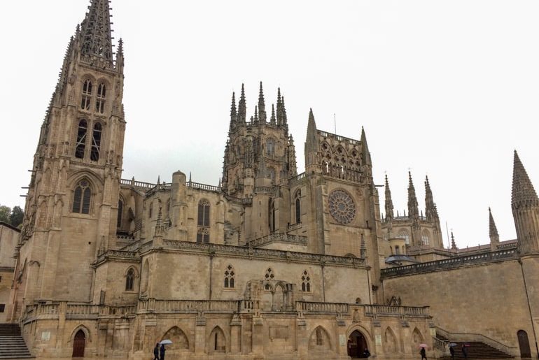 tan stone cathedral in rain burgos spain itinerary