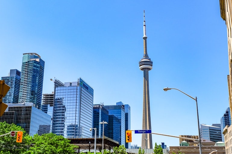 cn tower in toronto with skyscrapers and luxury hotels beside