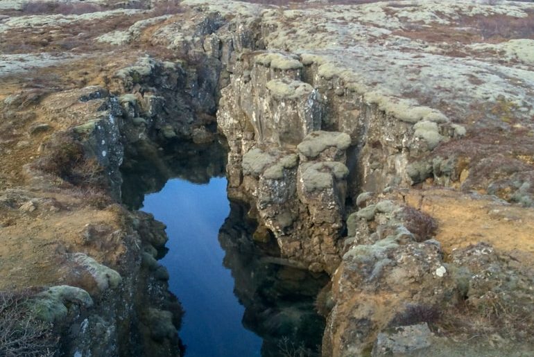 gap in rocks in icelandic landscape golden circle tour