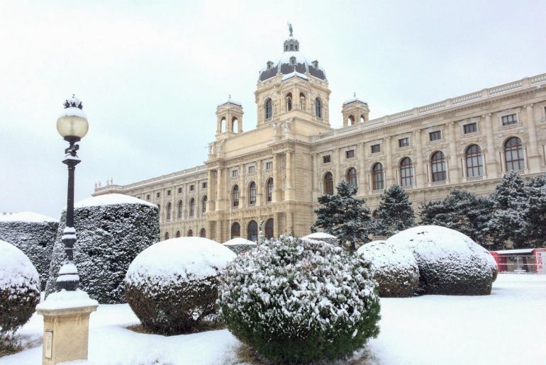 old museum building with snowy bushes in front things to do in vienna austria
