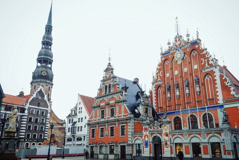 old colourful town hall in riga old town square travelling the baltics