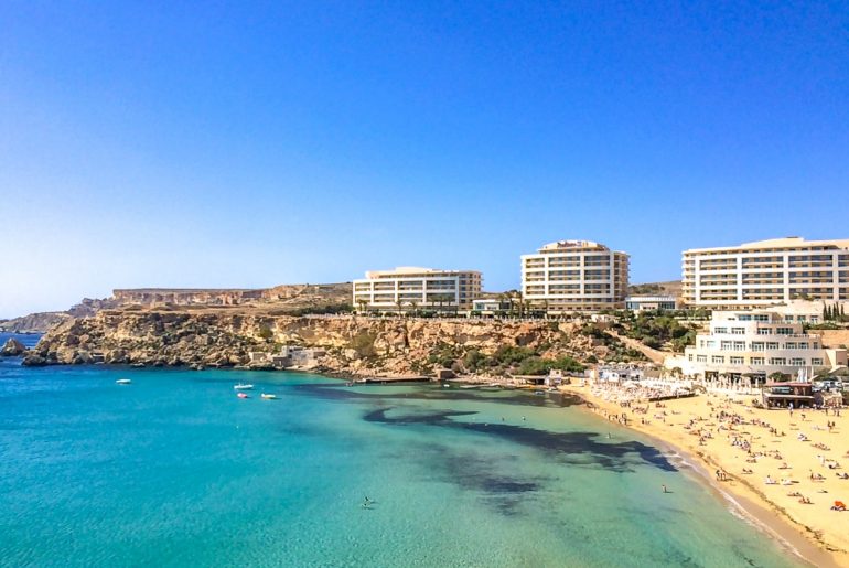 beach and resort hotels on cliff beside best places to stay in malta mellieha