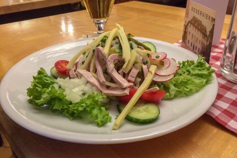 wurstsalat on white plate with cheese things to do in aschaffenburg bavarian meal