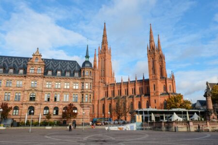 red brick church and main square with blue sky things to do in wiesbaden germany