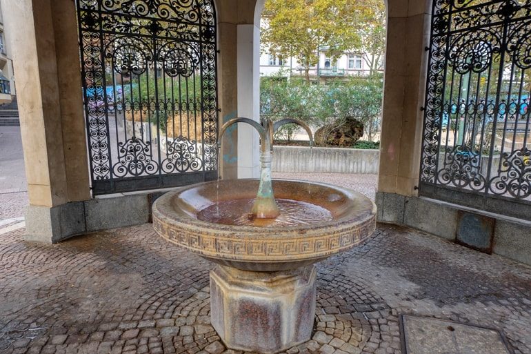 hot mineral water fountain in stone arch things to do in wiesbaden