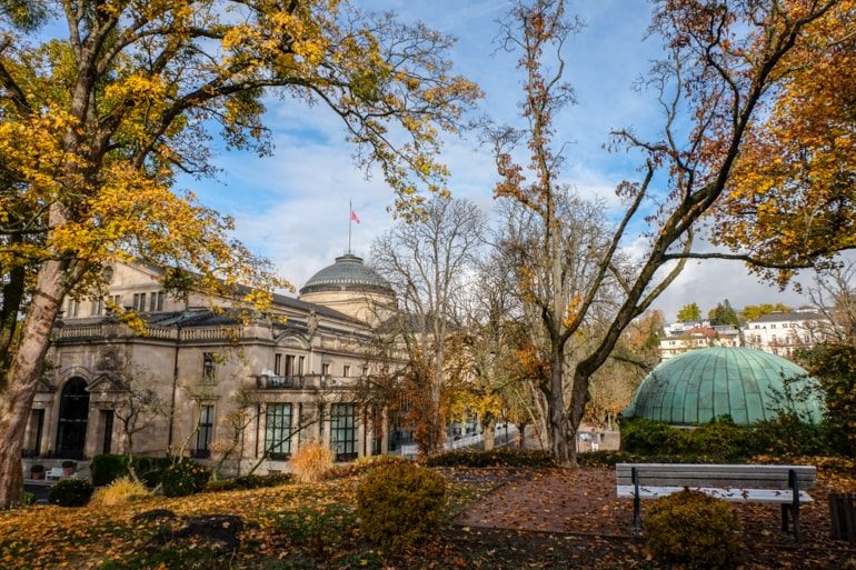 theatre building through autumn trees things to do in wiesbaden