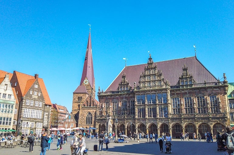 old town hall building with church behind on open market square in bremen germany