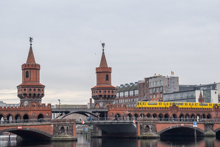red bridge with yellow train on it berlin hostels in germany