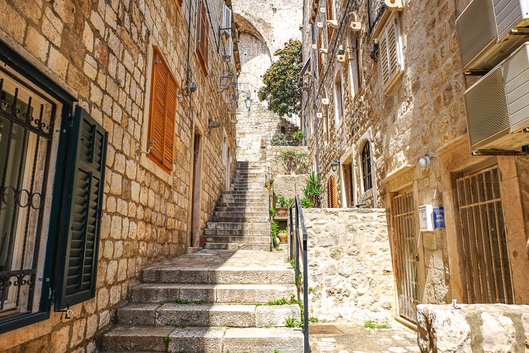 tall stone stairs facing old town walls with doors in dubrovnik