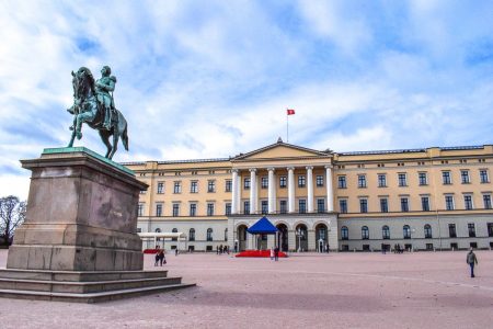 yellow palace building with horse statue where to stay in oslo