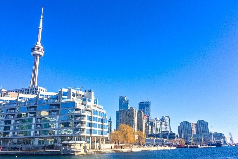 tower and buildings at blue waterfront one day in toronto