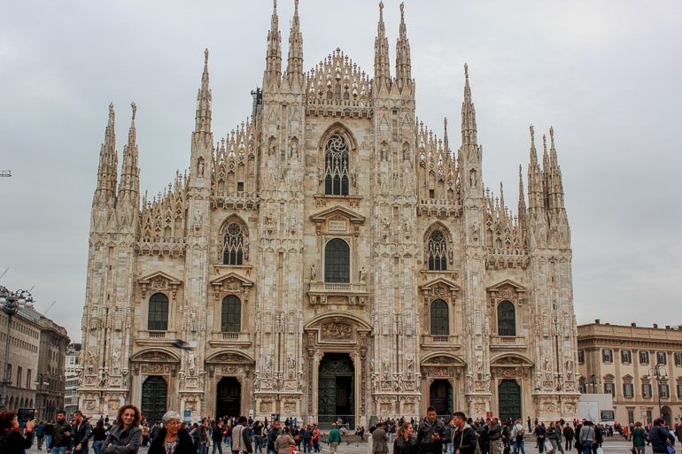 white detailed cathedral front in milan italy
