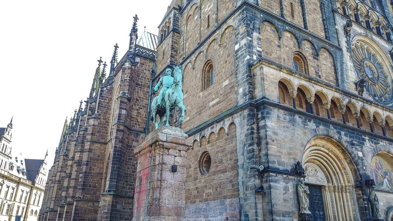 green statue of man on horse beside bremen dom things to do