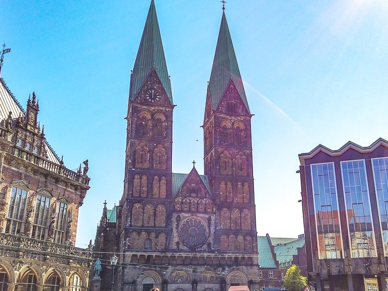 two towers of cathedral on bremen germany with blue sky behind