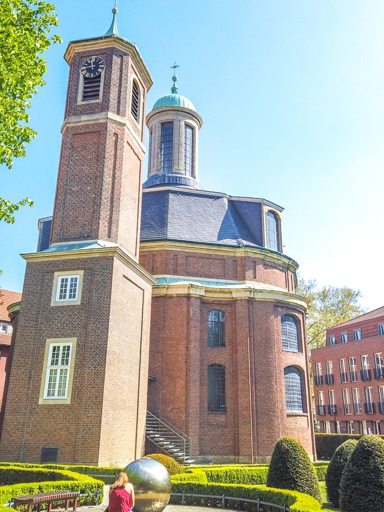 red brick church in small green park munster germany