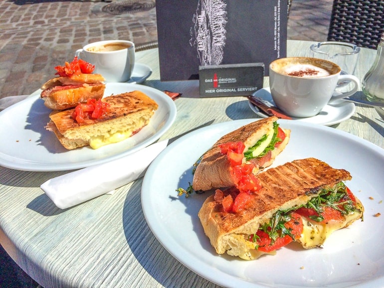 ciabattas on plates with coffees on table in munster germany