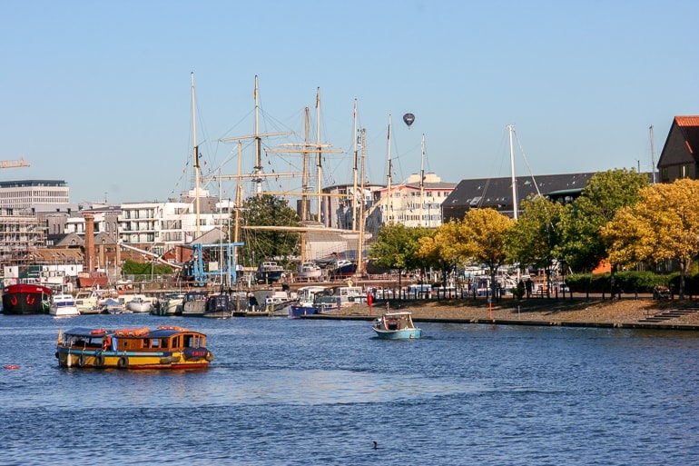 ship in water with cranes along water edge in bristol.