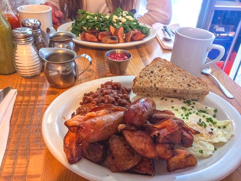 two plates of brunch food on wooden table wilf and ada's ottawa