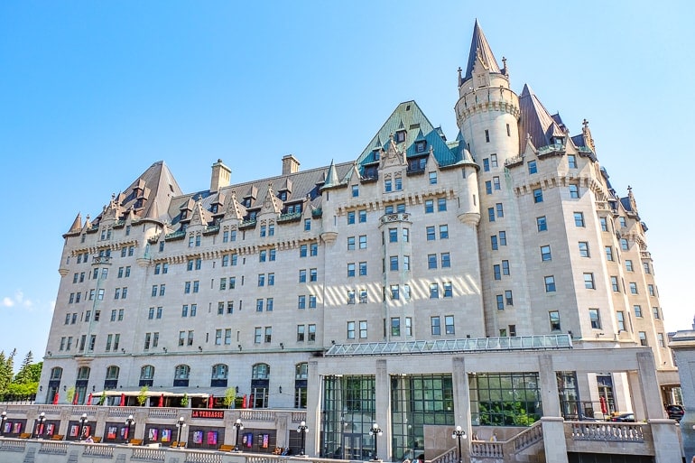 white old hotel with blue sky behind chateau laurier one day in ottawa high tea