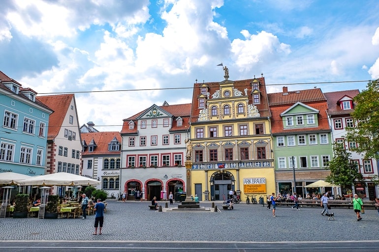 yellow old town building with square in front things to do in erfurt germany fischmarktplatz