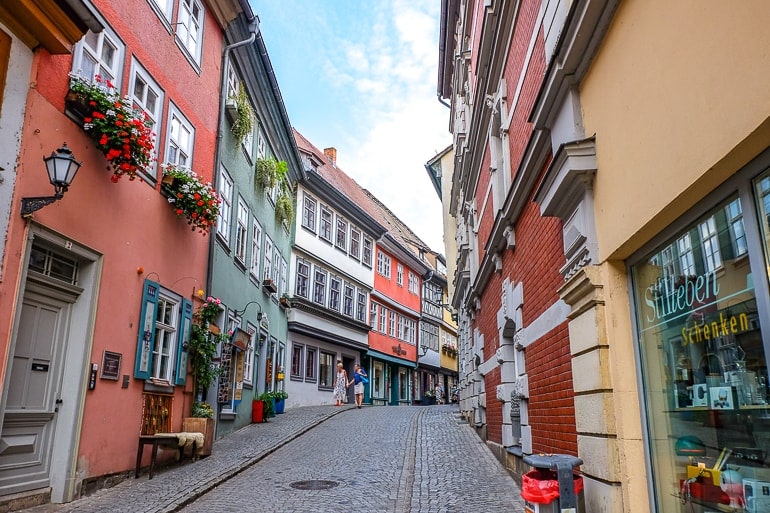colourful shops with cobblestone road in middle of Krämerbrücke erfurt germany