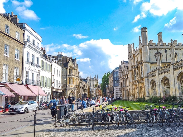 old english town buildings with bikes parked and people in cambridge uk