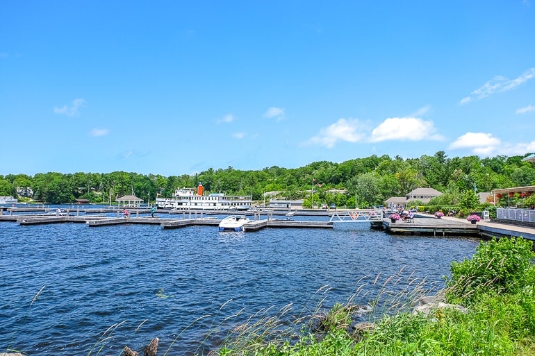blue lake with docks and ferry parked gravenhurst ontario day trips from toronto