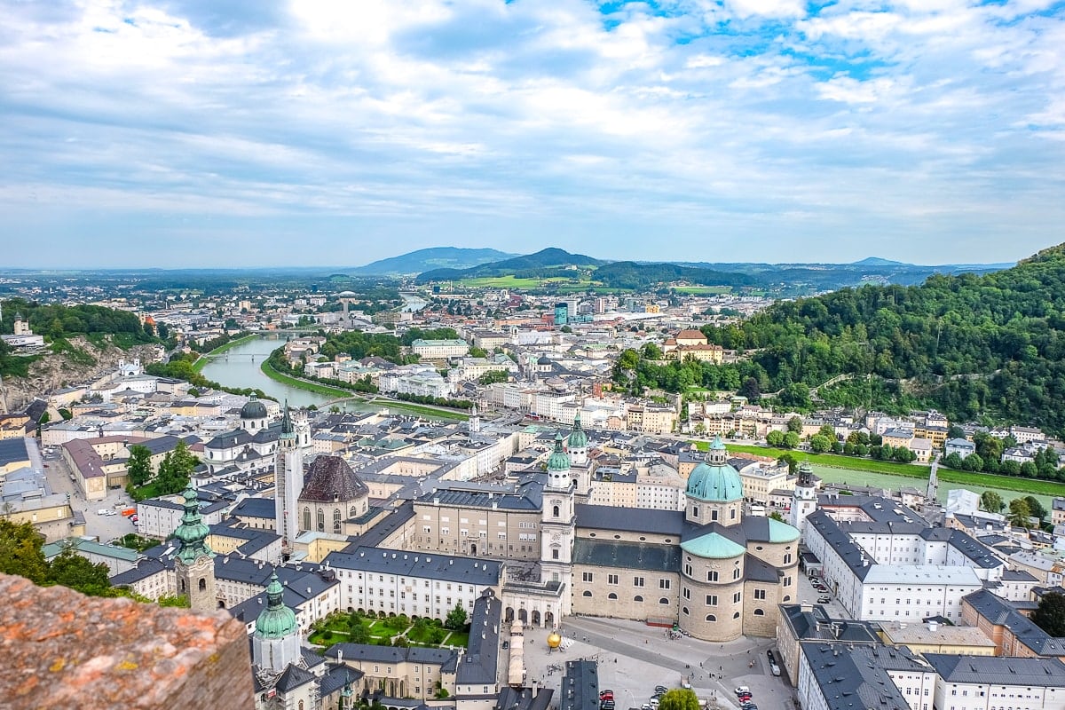 building roofs in city with river running through centre in Salzburg
