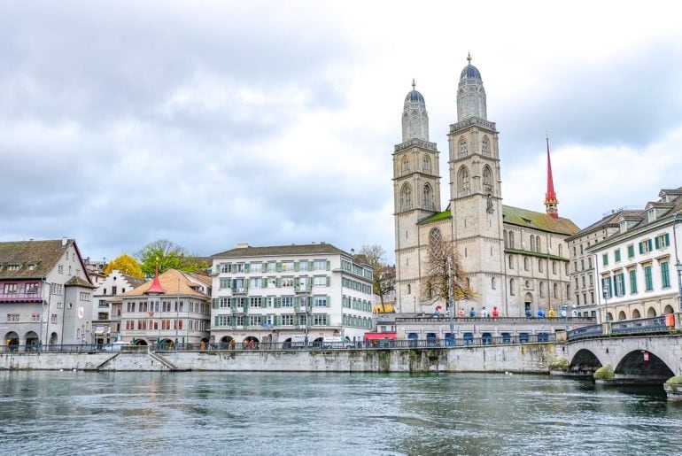 cathedral with two towers in old town by river one day in zurich