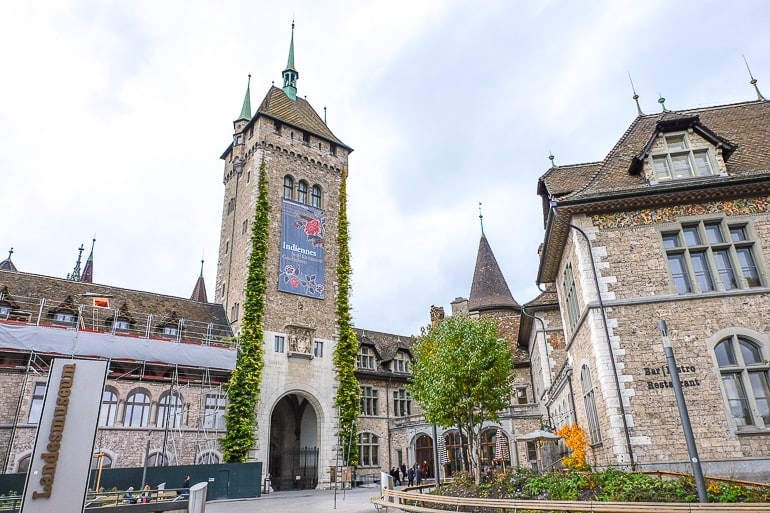 museum entrance with archway and tower in zurich