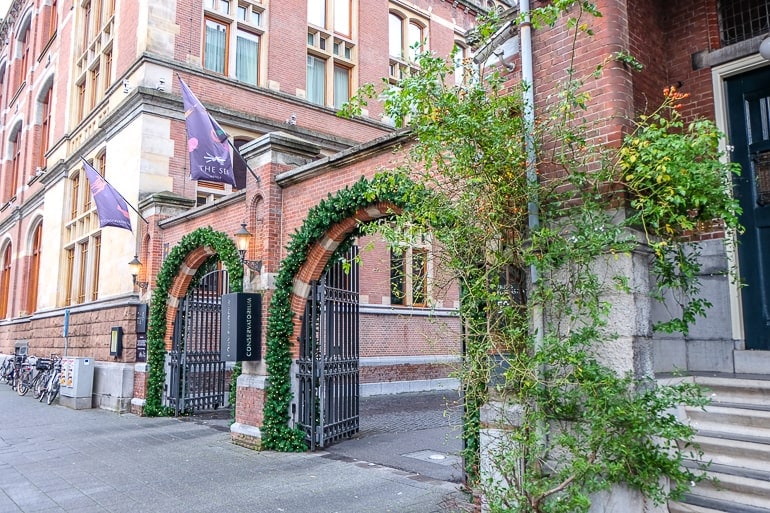 two red brick arches with green vines covering
