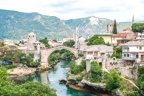 stone bridge over blue river in old town mostar bosnia