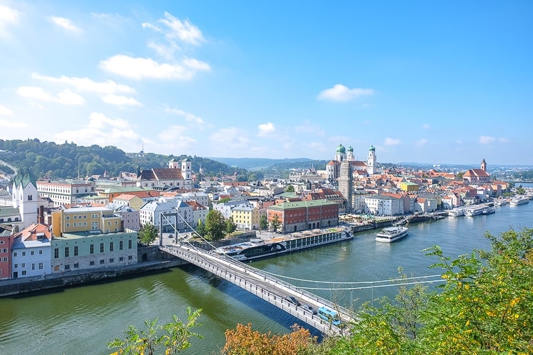 old town passau germany with churches in background and bridge over danube river in foreground.