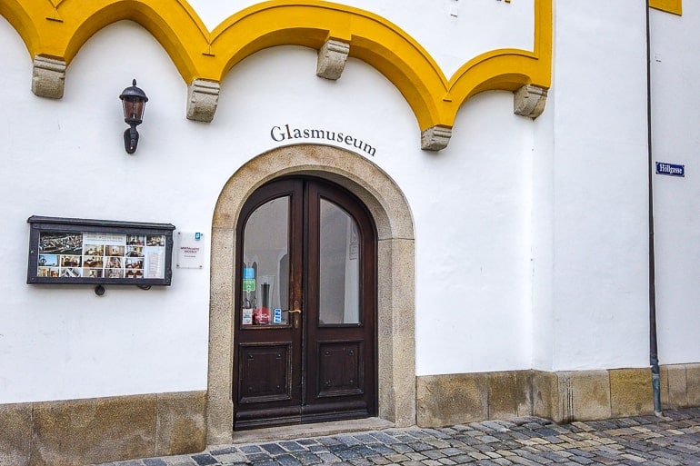 entrance to glass museum with yellow trim above door
